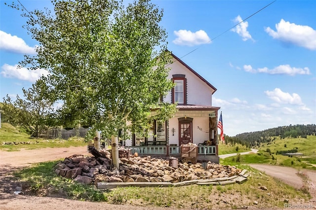 310 E Whiting Ave, Cripple Creek, CO 80813 - view of front facade featuring a porch, a metal roof, and a standing seam roof