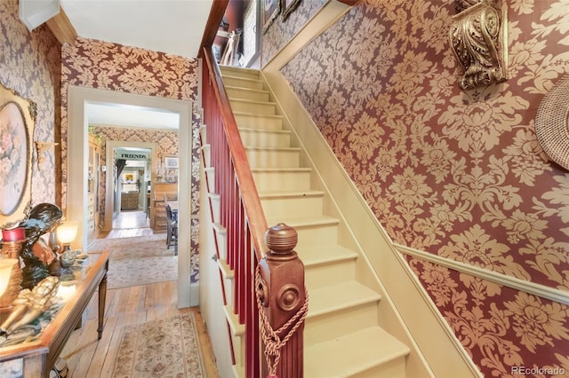 310 E Whiting Ave, Cripple Creek, CO 80813 - stairway featuring wallpapered walls and wood finished floors