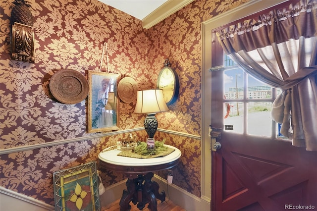 310 E Whiting Ave, Cripple Creek, CO 80813 - entryway featuring wallpapered walls, wood finished floors, and ornamental molding