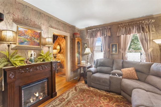 310 E Whiting Ave, Cripple Creek, CO 80813 - living area featuring wood finished floors and a lit fireplace