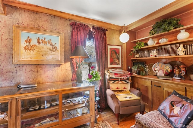 310 E Whiting Ave, Cripple Creek, CO 80813 - living area with wood finished floors, wood walls, and ornamental molding
