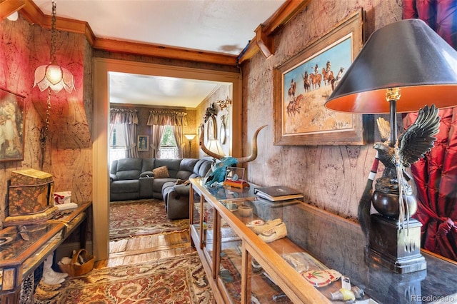 310 E Whiting Ave, Cripple Creek, CO 80813 - living area featuring crown molding, wooden walls, and wood finished floors