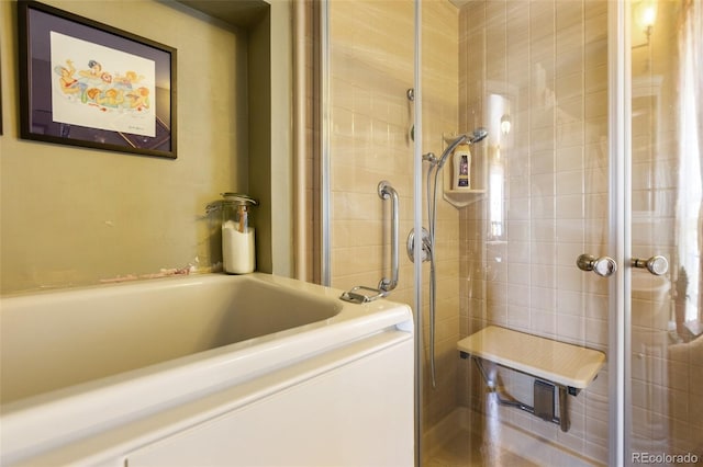 310 E Whiting Ave, Cripple Creek, CO 80813 - bathroom featuring tiled shower and a bath