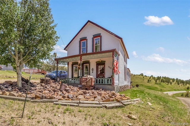 310 E Whiting Ave, Cripple Creek, CO 80813 - view of front of home with a porch and brick siding