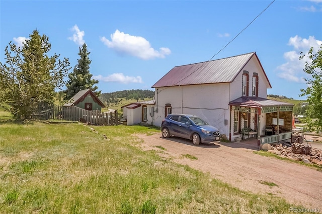 310 E Whiting Ave, Cripple Creek, CO 80813 - view of property exterior featuring a metal roof and dirt driveway