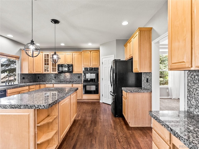 kitchen with sink, dark wood-type flooring, black appliances, a kitchen island, and light brown cabinetry