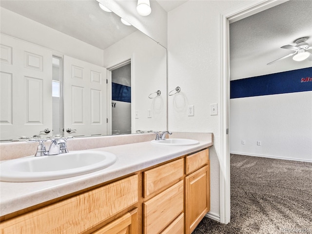 bathroom featuring vanity and ceiling fan