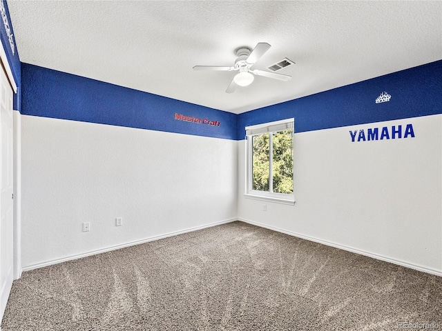 spare room with a textured ceiling, ceiling fan, and carpet flooring