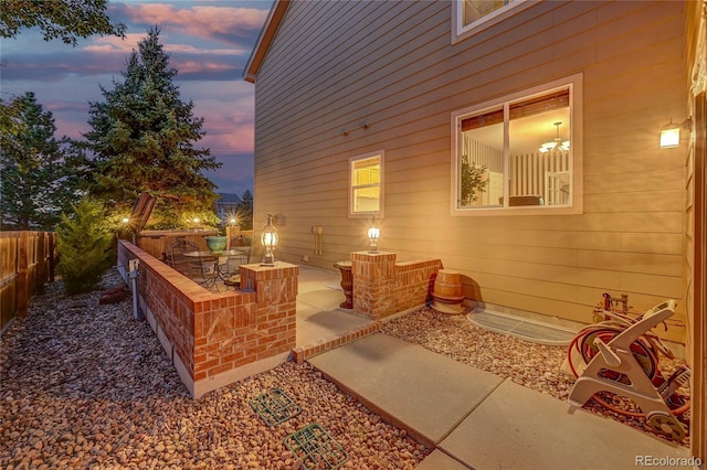 view of patio terrace at dusk