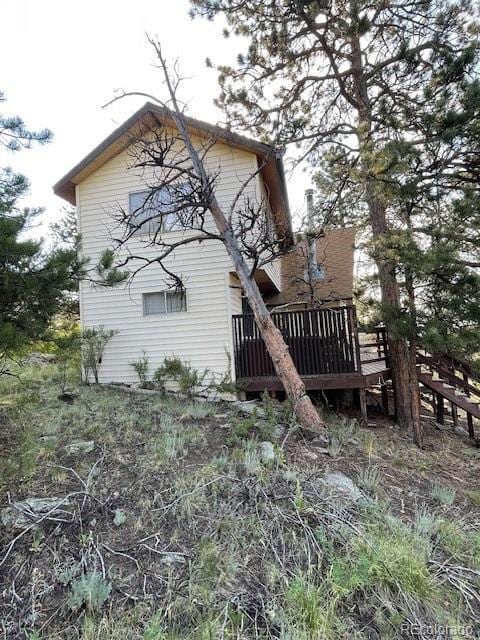 view of property exterior featuring a deck