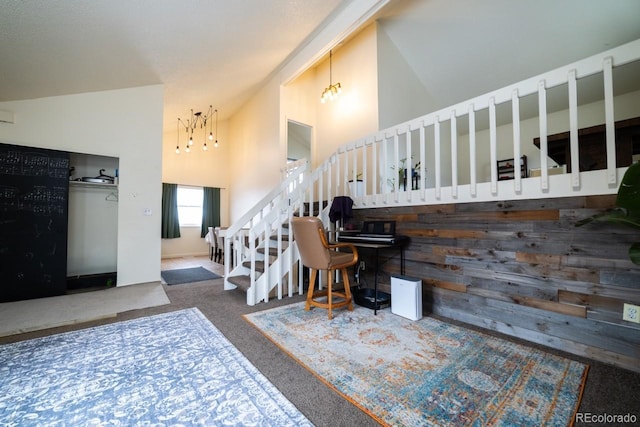 entryway featuring carpet floors, wood walls, and vaulted ceiling