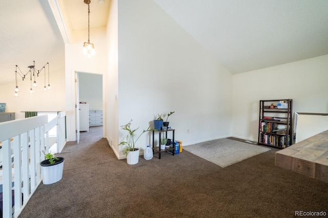 interior space with high vaulted ceiling and carpet flooring