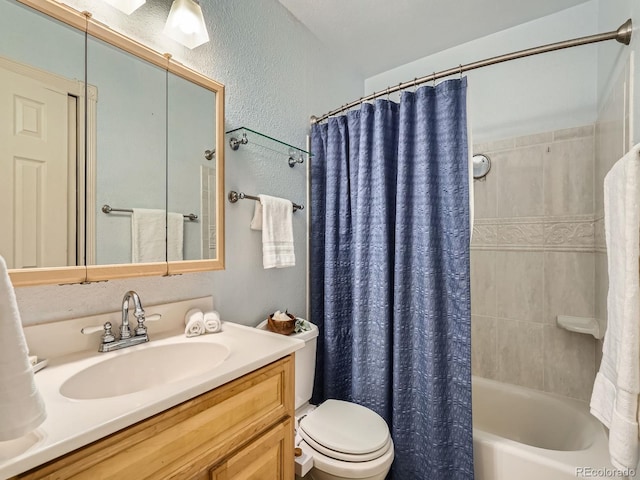 full bathroom featuring toilet, shower / bathtub combination with curtain, and vanity