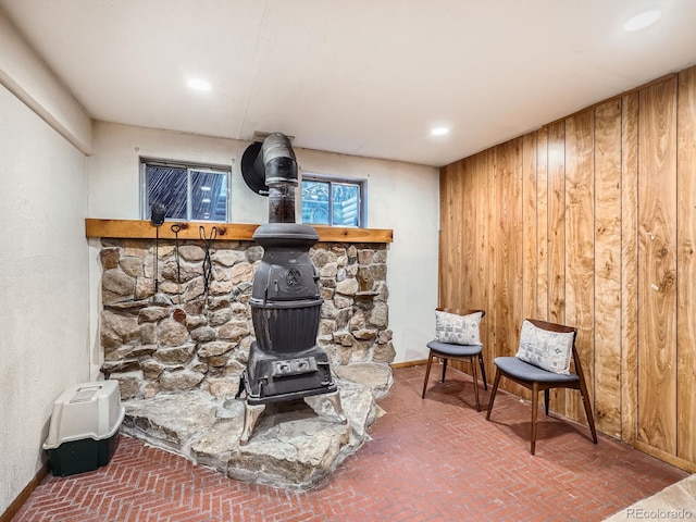 room details with wood walls and a wood stove