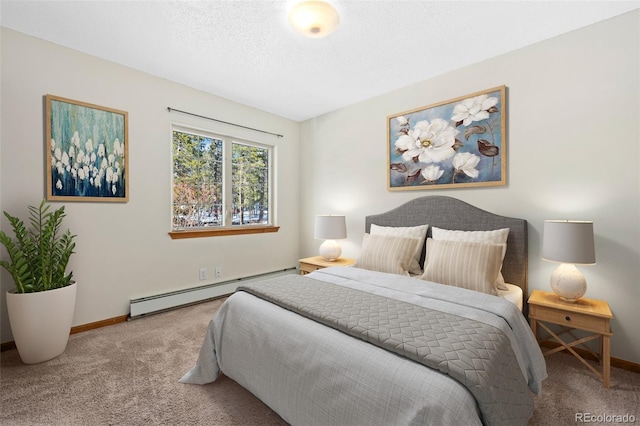 carpeted bedroom with a baseboard radiator, baseboards, and a textured ceiling