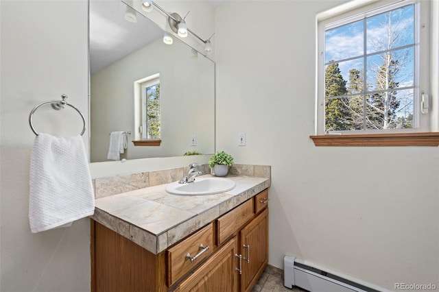 bathroom with vanity and a baseboard radiator