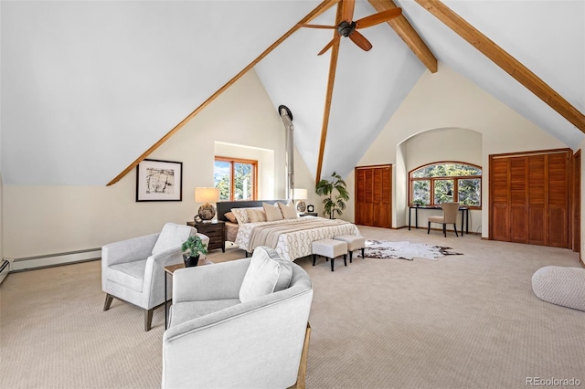 living room with a wealth of natural light, beam ceiling, light colored carpet, and ceiling fan