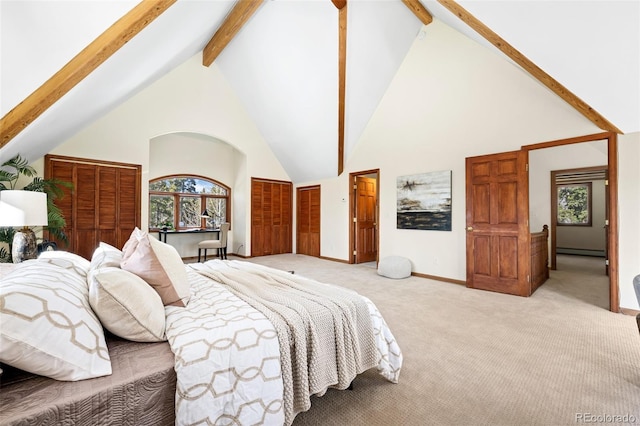 bedroom with beam ceiling, high vaulted ceiling, a baseboard heating unit, baseboards, and light colored carpet