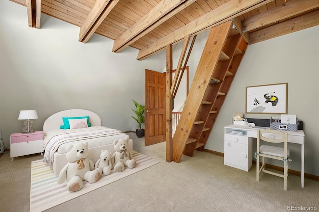 bedroom with baseboards, beam ceiling, light colored carpet, and wood ceiling