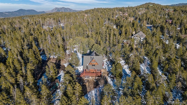 bird's eye view featuring a mountain view and a view of trees