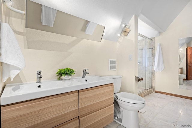 439 Ronnie Rd, Golden, CO 80403 - bathroom with toilet, a stall shower, and double vanity