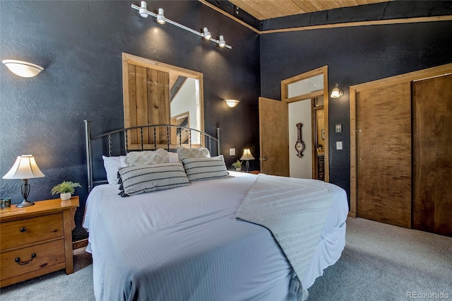 68 Starlit Ln, Blue River, CO 80424 - bedroom featuring wooden ceiling, high vaulted ceiling, and carpet