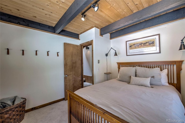 68 Starlit Ln, Blue River, CO 80424 - bedroom with baseboards, carpet, wood ceiling, beamed ceiling, and rail lighting