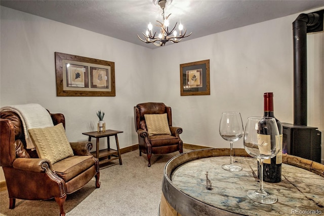 68 Starlit Ln, Blue River, CO 80424 - sitting room featuring light colored carpet, baseboards, an inviting chandelier, and a wood stove