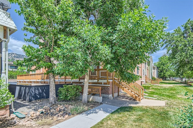 exterior space with a yard and a deck