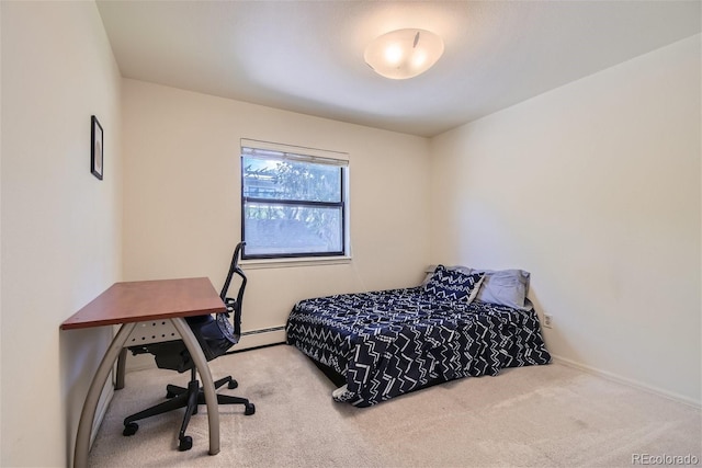 bedroom with carpet floors and baseboard heating