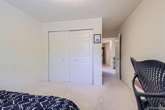 bedroom with carpet floors and a closet