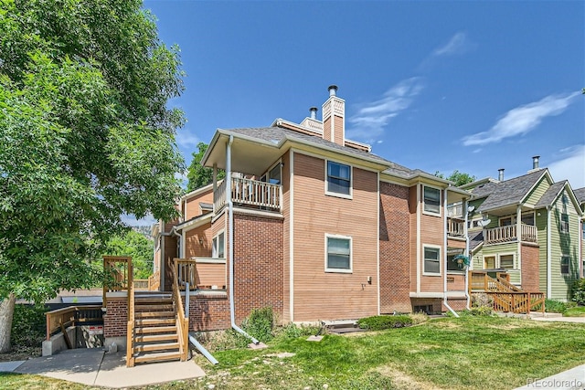 view of property exterior featuring a yard and a balcony