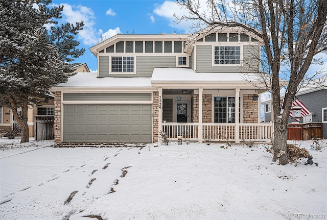 view of front facade featuring a garage and covered porch