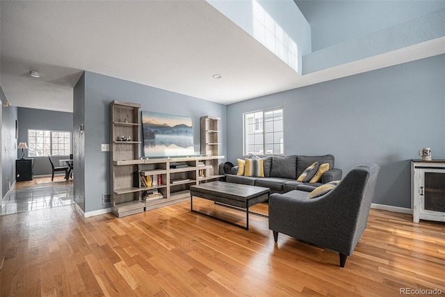 living room with wood finished floors and baseboards