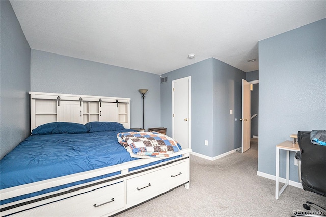 bedroom with visible vents, baseboards, and light colored carpet