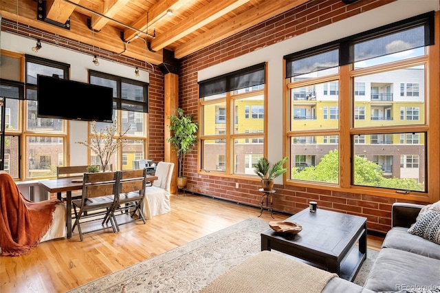 2955 Inca St Unit 2P, Denver, CO 80202 - sunroom featuring rail lighting, beamed ceiling, and healthy amount of natural light