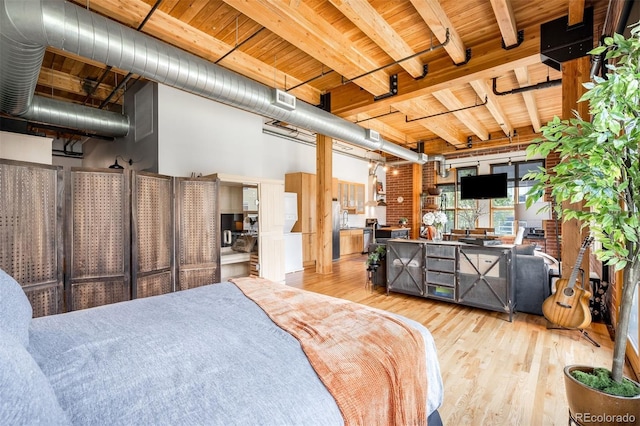 2955 Inca St Unit 2P, Denver, CO 80202 - bedroom with wood finished floors and a wooden ceiling with exposed beams