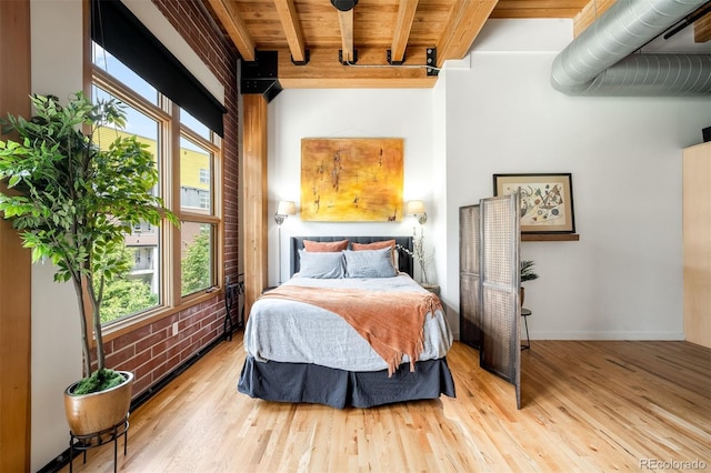 2955 Inca St Unit 2P, Denver, CO 80202 - bedroom with multiple windows, a wood ceiling with exposed beams, and wood finished floors