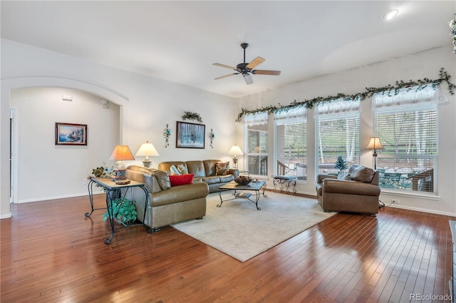 living room with ceiling fan and hardwood / wood-style floors