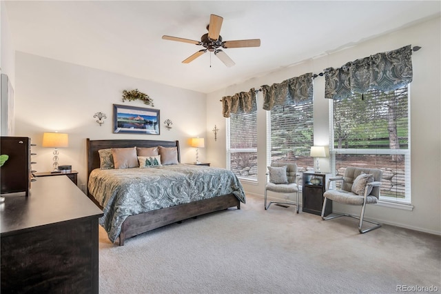 bedroom featuring ceiling fan and light carpet