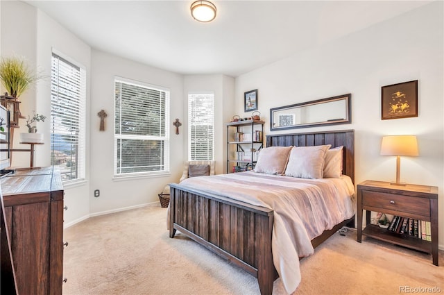 bedroom with light colored carpet