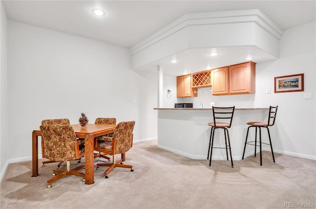 view of carpeted dining space