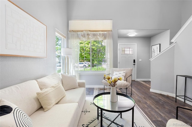 living area featuring wood finished floors and baseboards