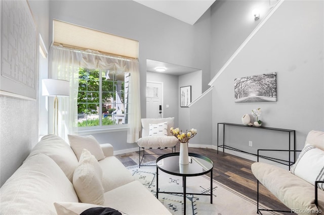 living area featuring wood finished floors and baseboards