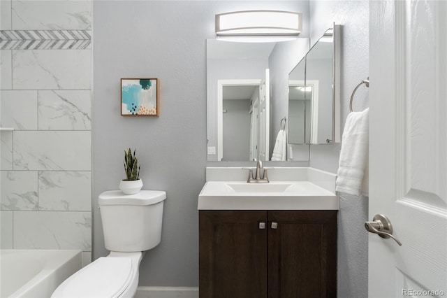 bathroom with toilet and vanity