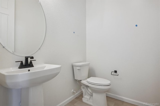 bathroom with toilet and sink