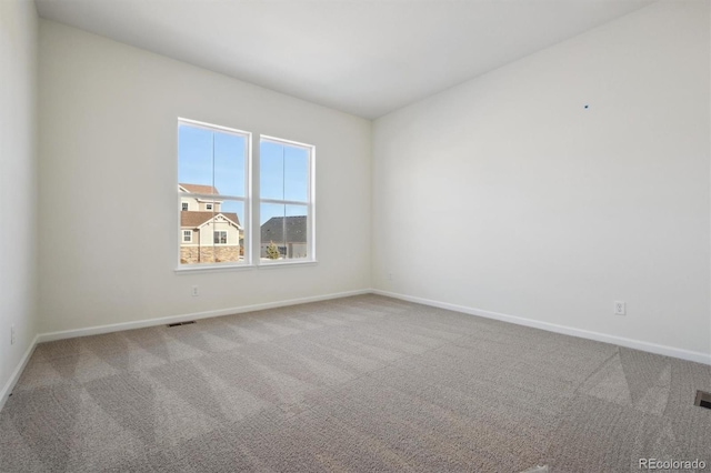 unfurnished room with carpet flooring