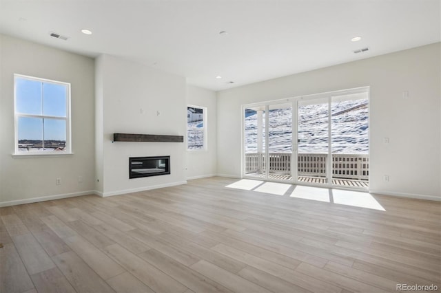 unfurnished living room featuring light hardwood / wood-style flooring