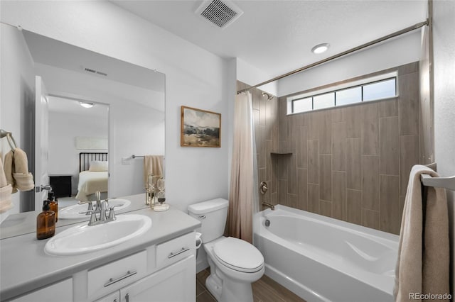 bathroom with toilet, vanity, ensuite bath, visible vents, and shower / bath combination with curtain