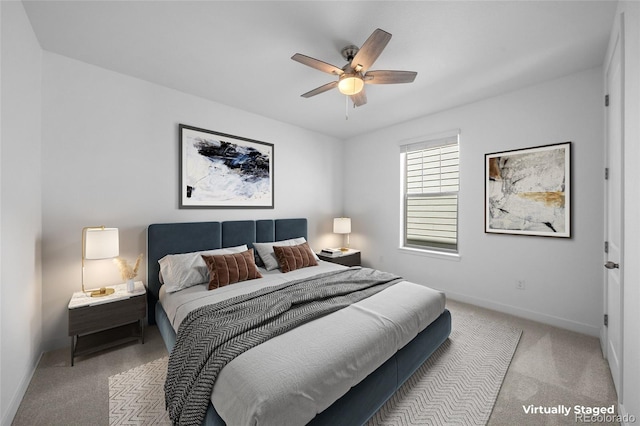 bedroom featuring baseboards, ceiling fan, and carpet